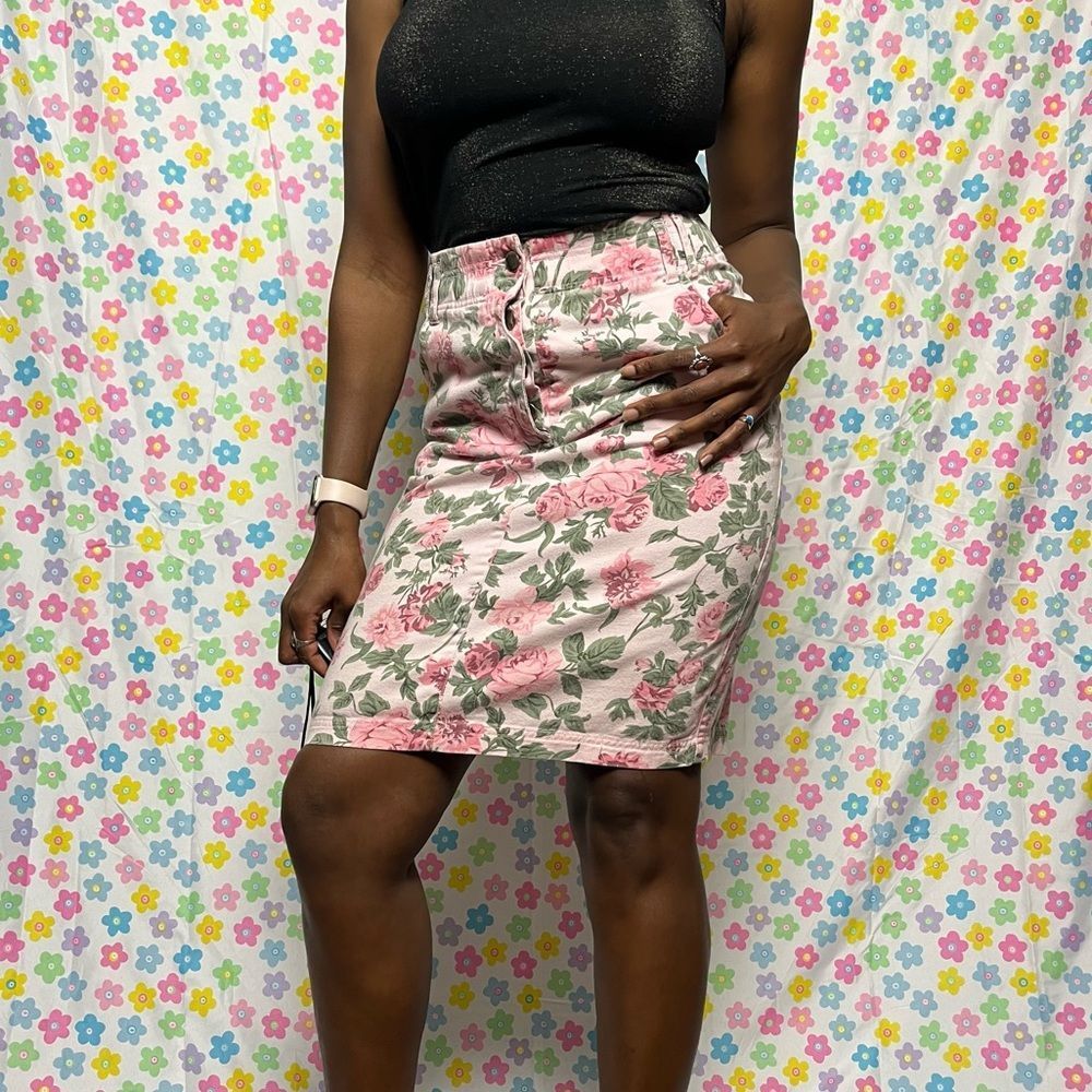 Really cute high waist pink floral skirt.  Slit in the back with pockets! Size 4